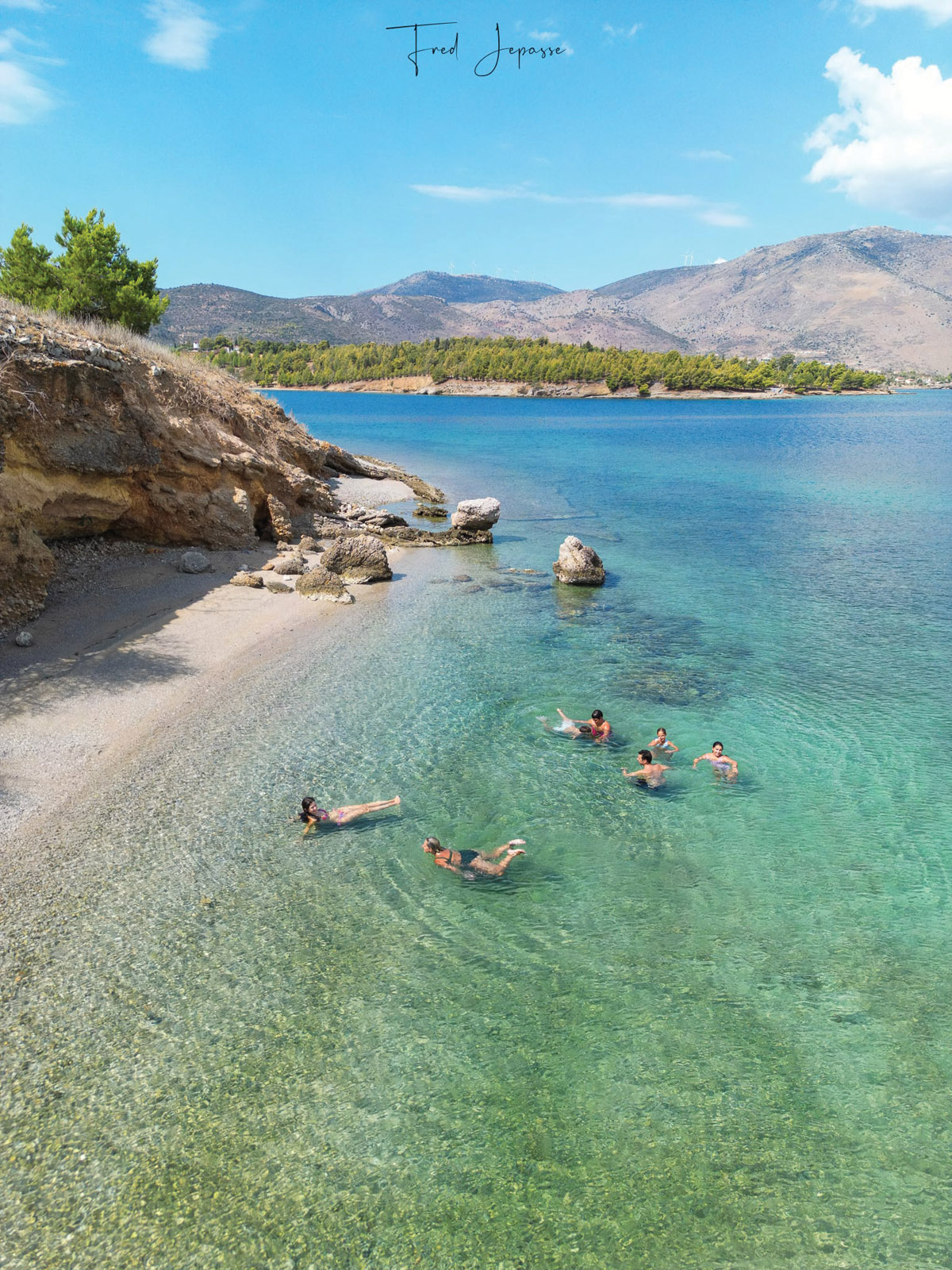 Swimming in the crystal-clear waters of one of the beaches close to the anchorage.