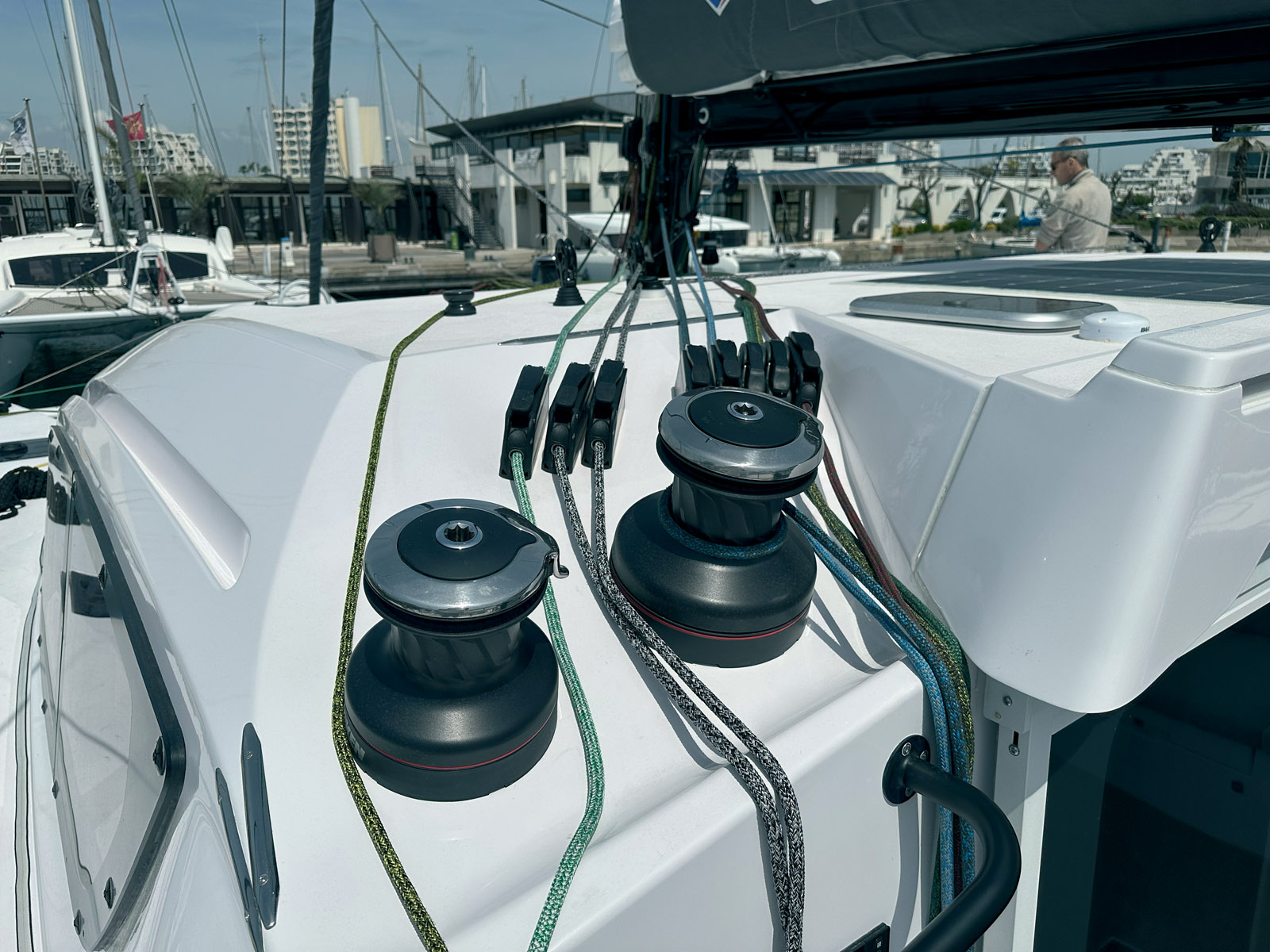 Reefing lines, halyards, and sheets for the mainsail and headsails converge at the console, located just forward of the helm station. This layout is designed for short-handed crews.
