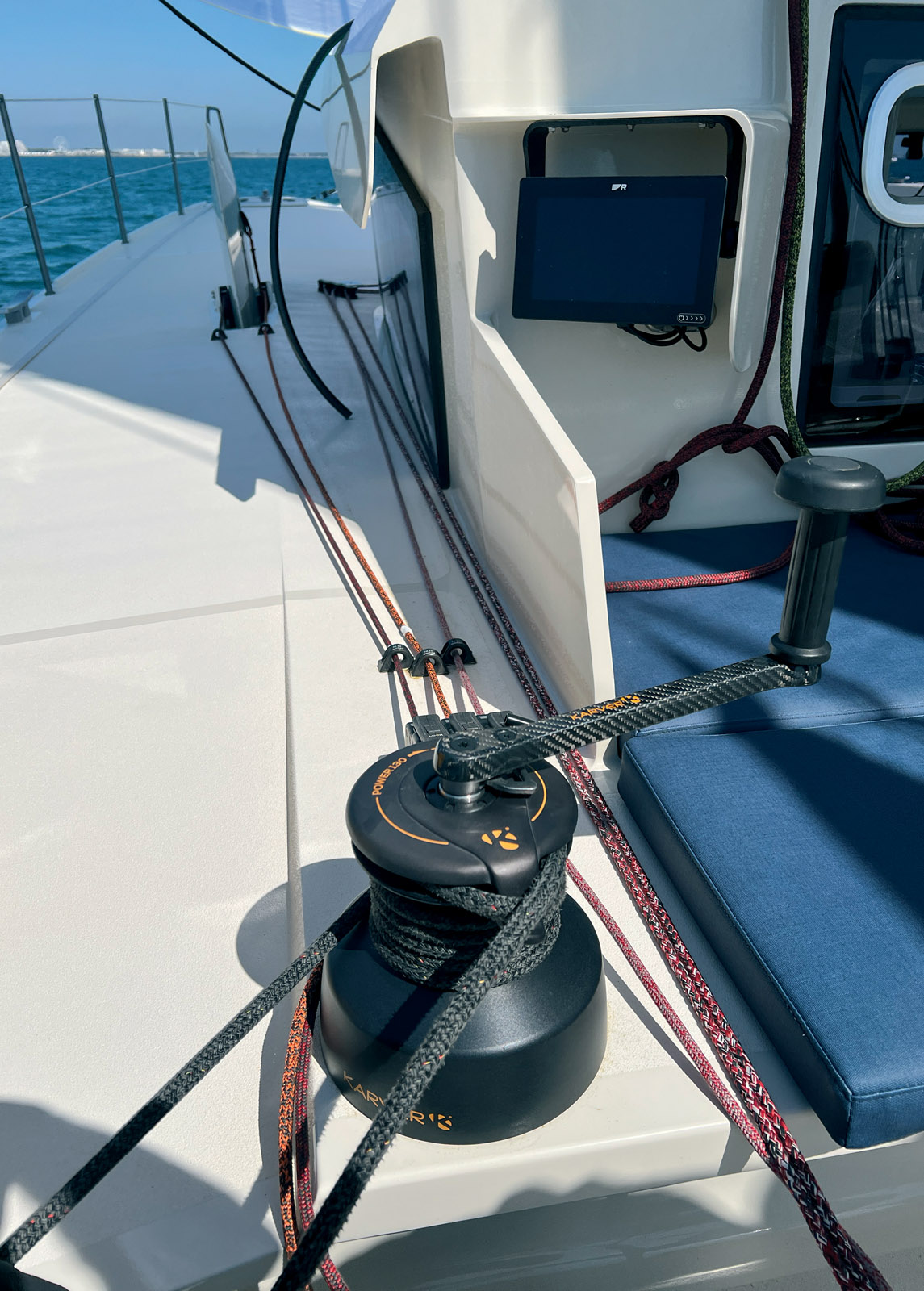 Despite the daggerboards, the side-decks remain very accessible. Note the coachroof overhang above the portholes and the side protection of the cockpit.