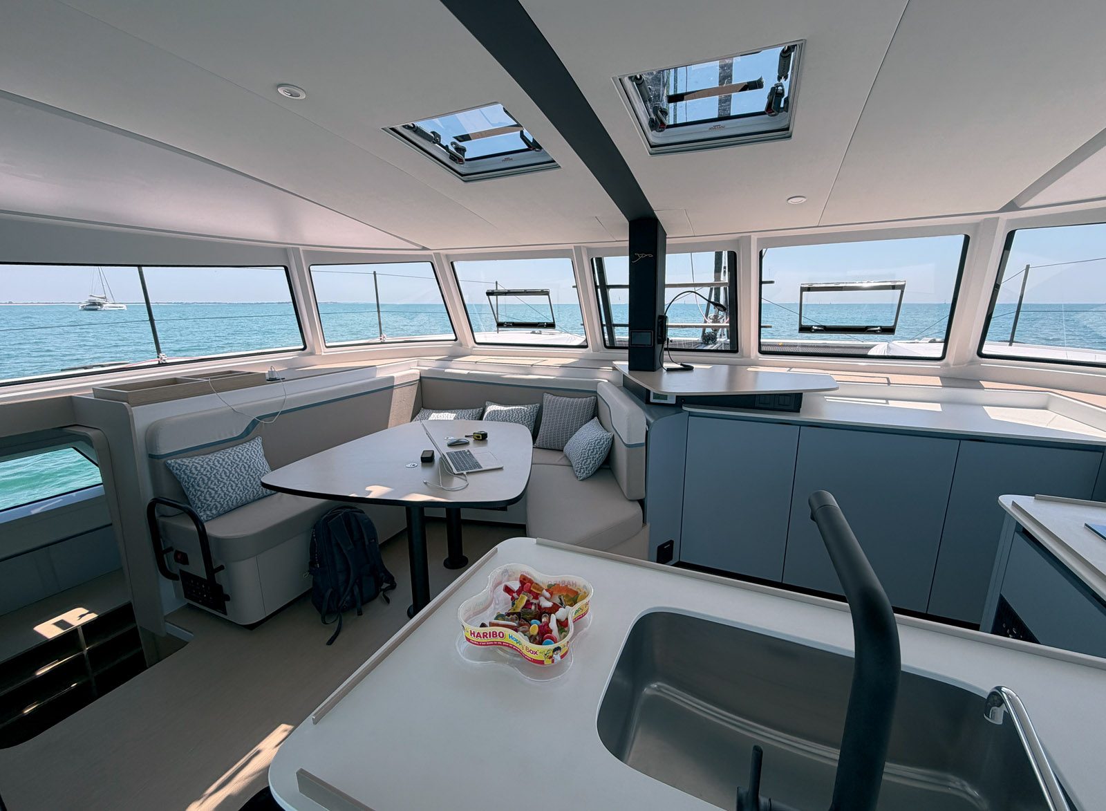 The ambiance is a stark contrast to that of the 40 Open. Contemporary materials and clean lines perfectly embody the “S” philosophy, where simplicity meets elegance. The galley’s large central countertop allows for standing work – fiddle rails are a welcome feature.