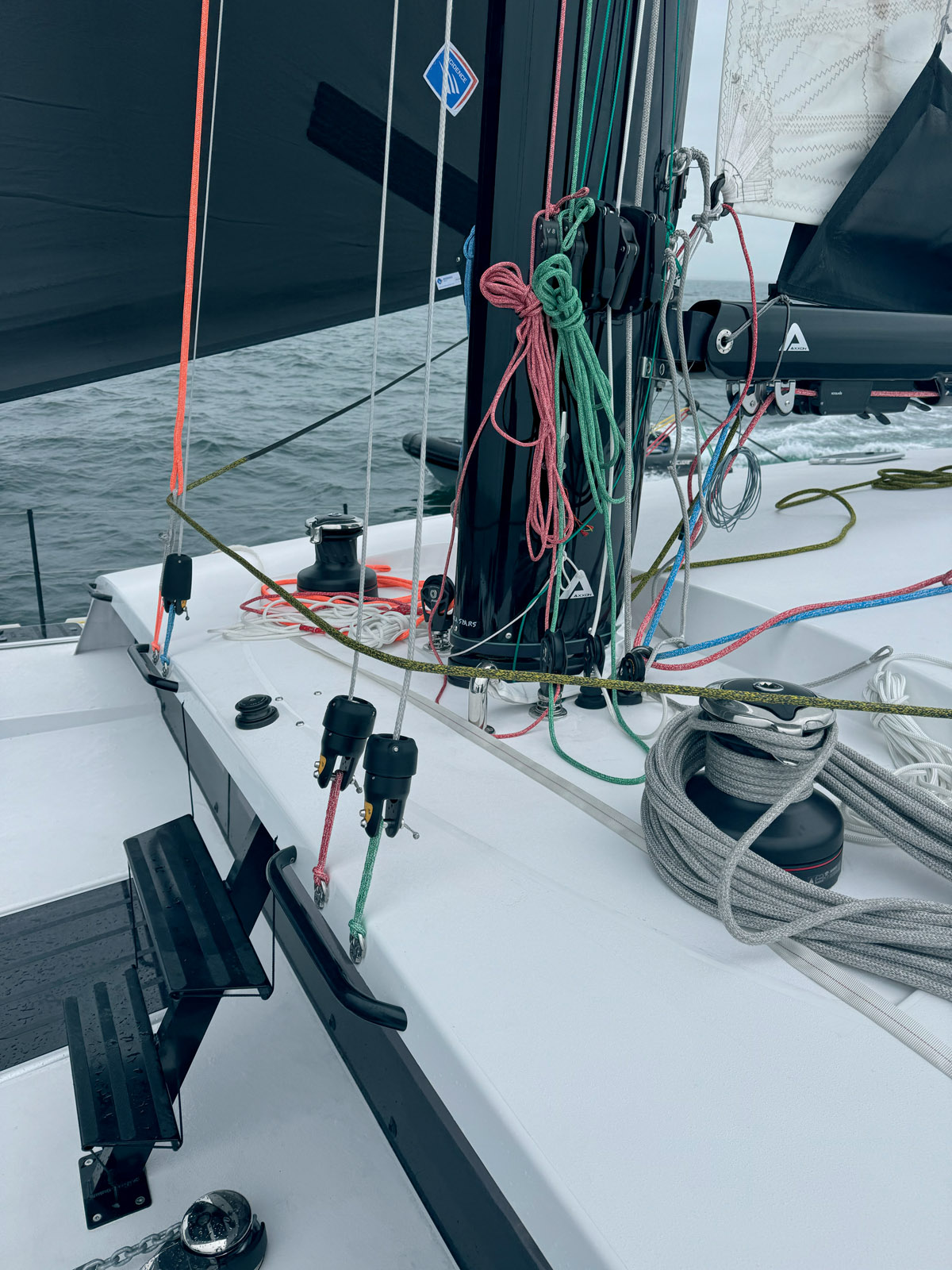 The impressive Axxon mast with the various headsail hooks. Two steps have been added to get to the mastfoot.