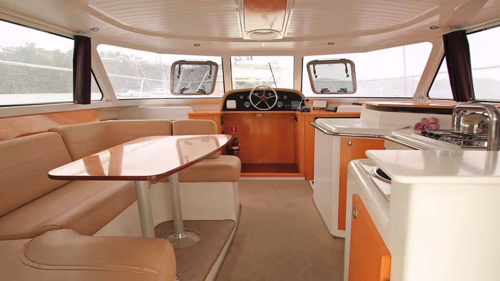 The central T-shaped area ideally houses the saloon, the galley, and helm station. Everything is within reach and it is very easy to move around. 