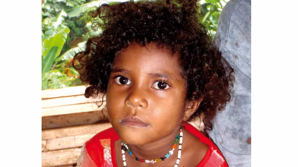 What can this little girl from the Louisiades possibly be thinking, meeting the occupants of a boat from the other side of the world?  