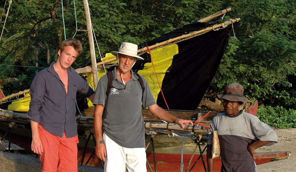 With Tim, my eldest son, who joined us in Vanuatu, and John the village chief on Nimoa. John was small and mischievous.  