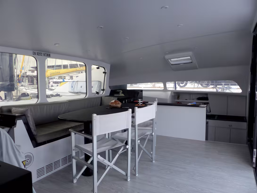 To allow a maximum of free space under way, folding chairs are used when required.  The opening above enhances the perspective. 