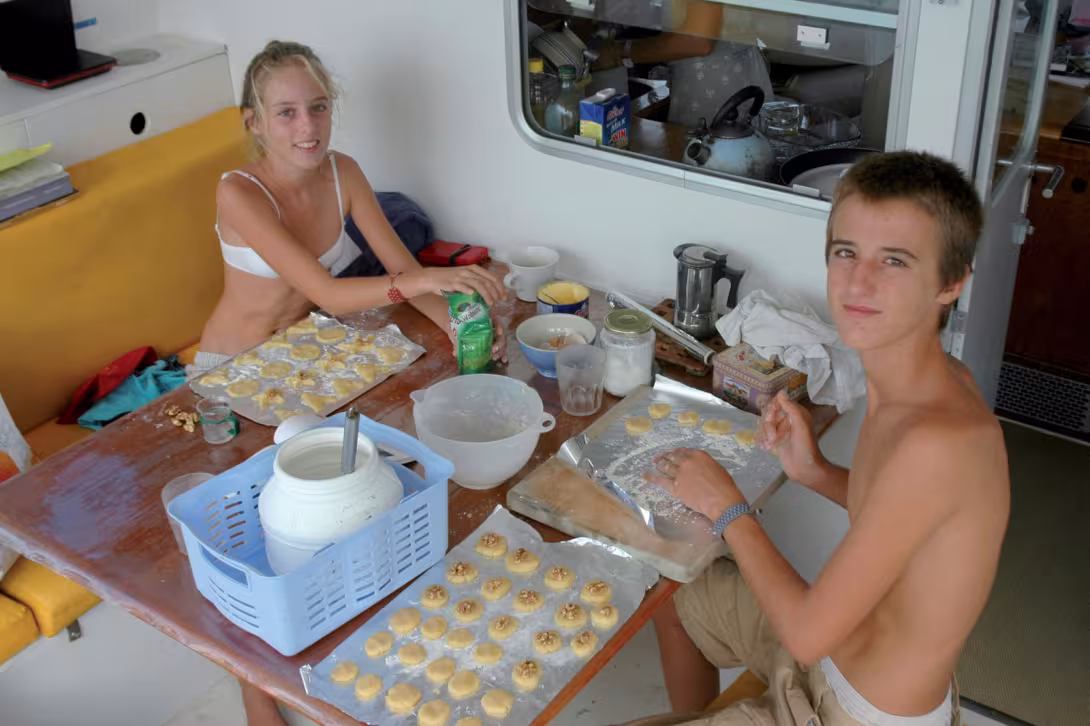 A spot of cake making helps to occupy the small crew of Jangada.  