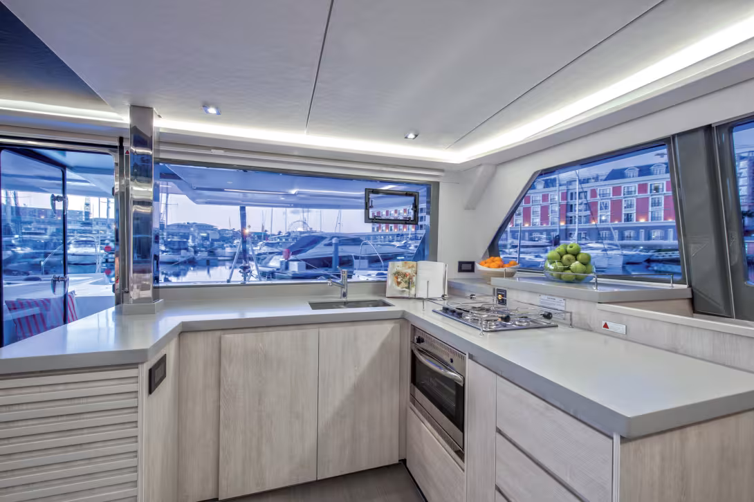 The galley is open to the front; the size of the worktops will allow use of these spaces as self-service areas. This will simplify the role of the cook who will be able to carry on in a relaxed atmosphere when cruising (there are no fiddles, so non-slip m