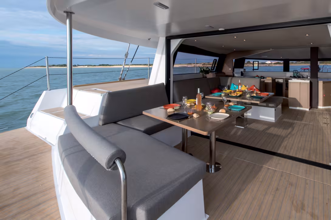 Neel did not invent the open space between the coachroof and the deck salon, nor flush-decked access, nor even the lounge deck, helm station or full forward vision. Yet these concepts from catamarans, placed on a 3-hull geometry, positioning the main cabi