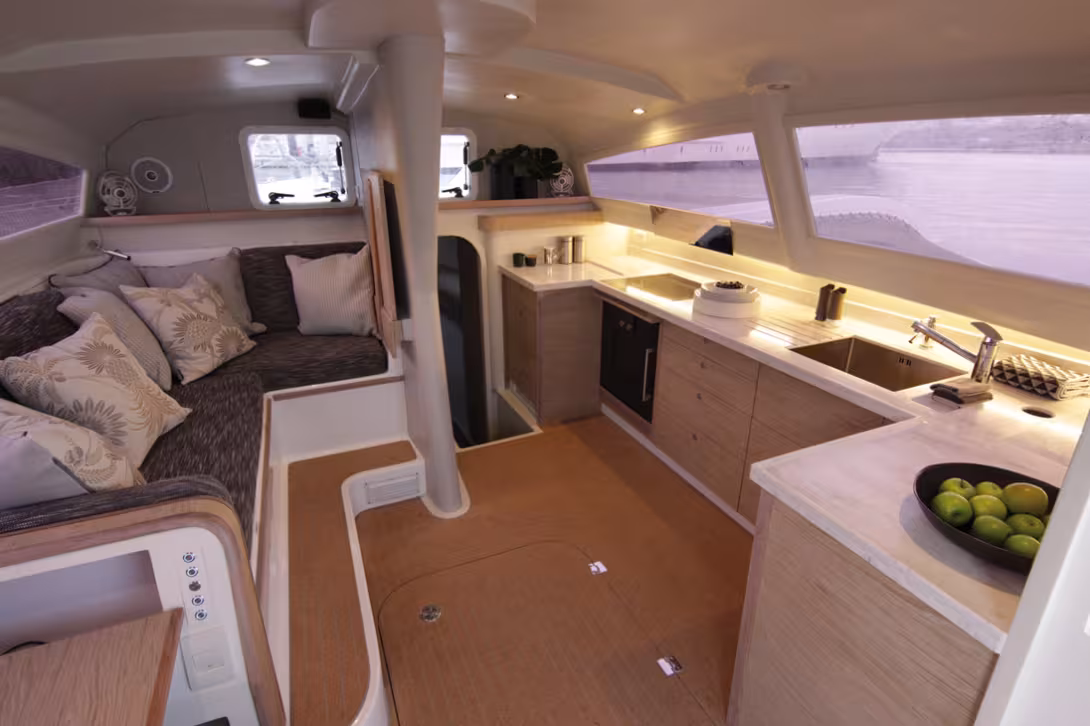 The saloon table is removable. Who could have imagined not so long ago such a galley aboard a performance trimaran? 