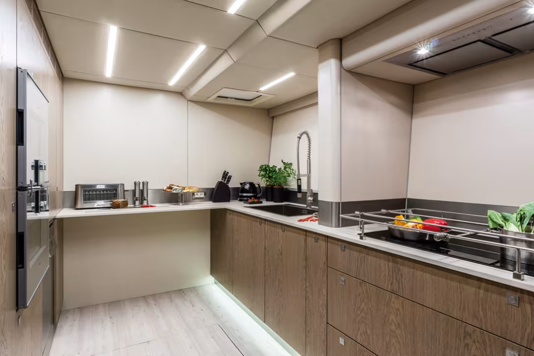 The galley is professionally equipped and offers really impressive storage space. A wine cellar and large freezers find their place in the cargo hold under the floor