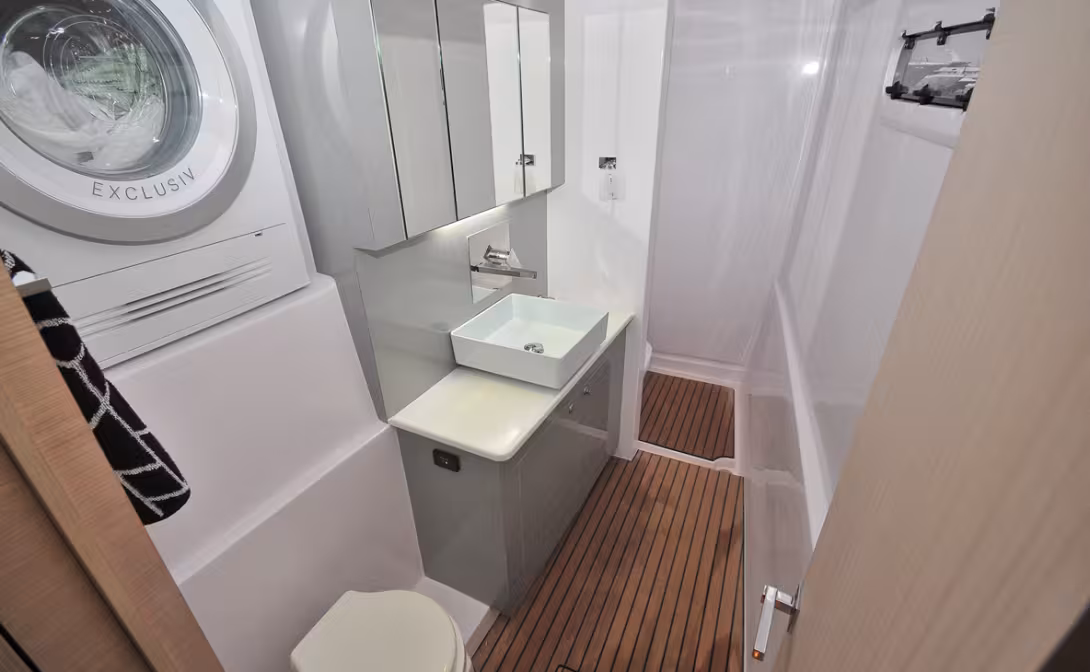 The bathroom in the starboard hull (owner’s). Beautiful, spacious and practical 