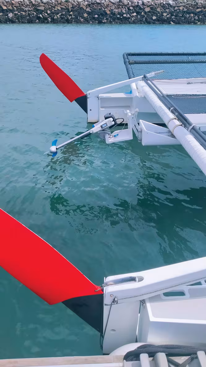 Fold-up rudders reduce draft to a minimum. Weight is kept light with a small electric outboard, though for port maneuvers, a more powerful one would be better.
