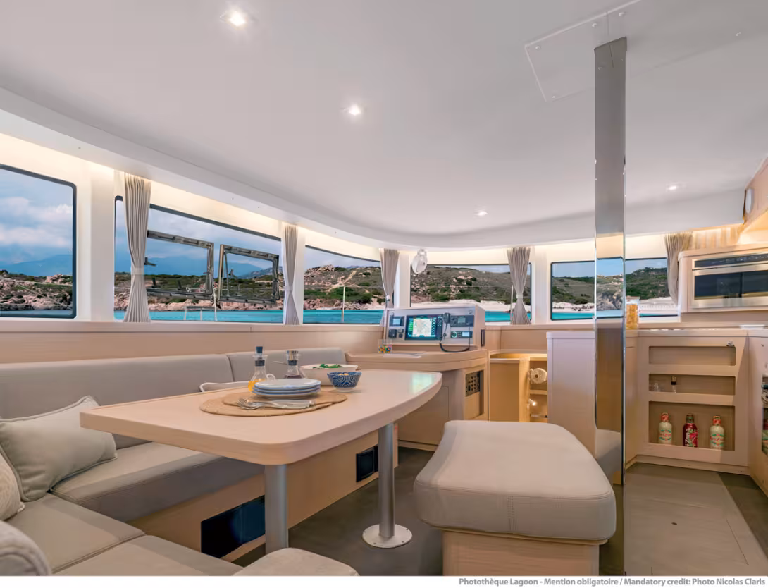 The nacelle sees the saloon area to port and the galley/chart table on the starboard side.